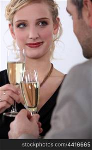 Elegant couple drinking champagne