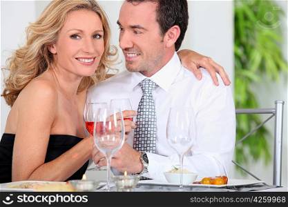 Elegant couple drinking wine