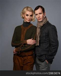 Elegant couple isolated on grey background