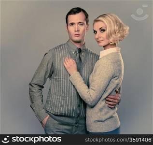 Elegant couple isolated on grey background