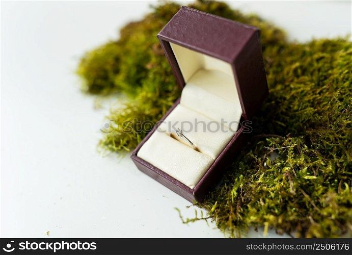 Elegant diamond ring in a box with a beige background. soft and selective focus. Marriage proposal concept. Elegant diamond ring in a box with a beige background. soft and selective focus. Marriage proposal concept.