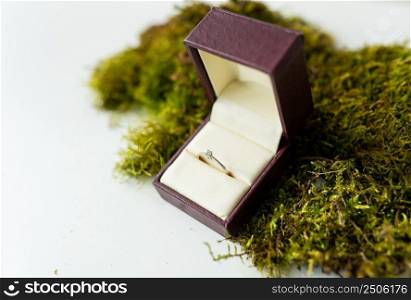 Elegant diamond ring in a box with a beige background. soft and selective focus. Marriage proposal concept. Elegant diamond ring in a box with a beige background. soft and selective focus. Marriage proposal concept.