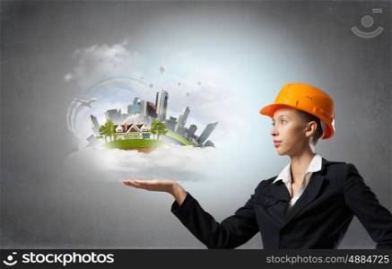 Elegant engineer woman. Attractive engineer woman presenting in palm construction project