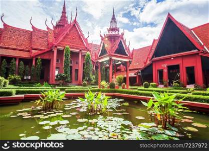 Elegant exterior of traditional Khmer architecture and beautiful courtyard of the National Museum of Cambodia, lush pond with water lilies, tourist attractions in Phnom Penh. The museum is open to the Public.