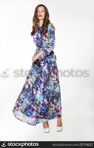 Elegant Fashionable Female in Silky Blue Flowery Dress