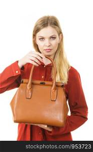 Elegant fashionable young woman with brown leather handbag, on white. Fashion woman with leather handbag