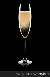 Elegant glass of yellow champagne with bubbles on black background with reflection