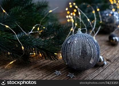 Elegant gray silver christmas close up scene on natural wood background. Elegant gray christmas
