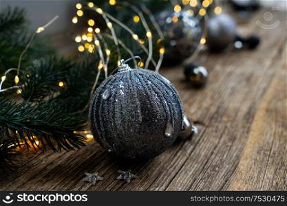 Elegant gray silver christmas scene on natural wood background, shallow focus. Elegant gray christmas