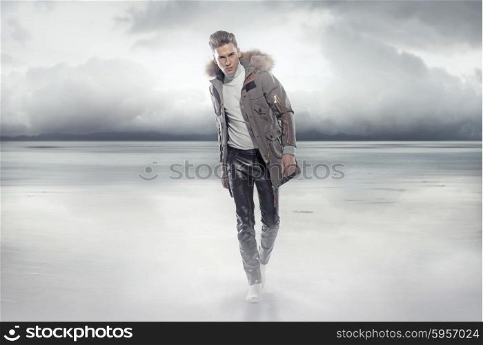Elegant guy walking on the frozen lake