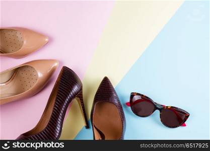 Elegant high heel shoes. Elegant high heel shoes and sunglasses, flat lay style scene