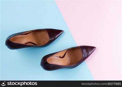 Elegant high heel shoes. Elegant high heel shoes on blue and pink background