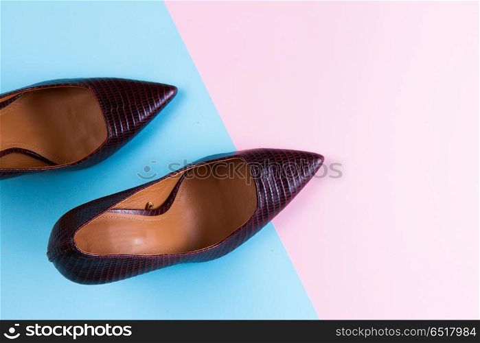 Elegant high heel shoes. Pair of Elegant high heel shoes on blue and pink background