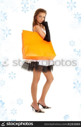 elegant lady with orange shopping bag and snowflakes