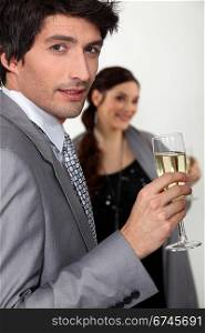 Elegant man drinking champagne