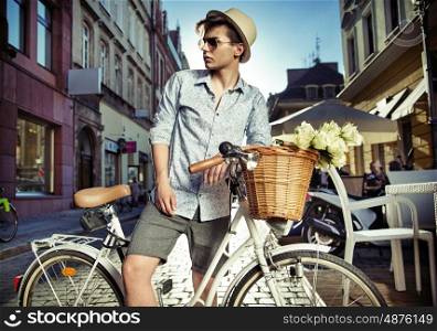 Elegant man on the retro bike