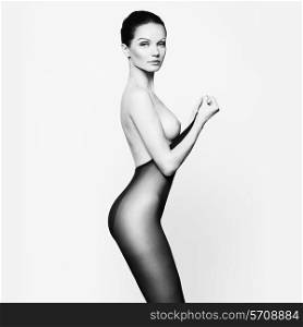 Elegant nude woman in pantyhose. Fashion art photo