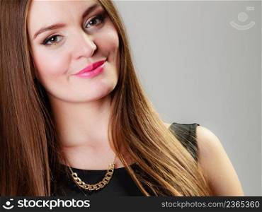 Elegant outfit. Young stylish woman fashionable girl in necklace on gray. Fashion and female beauty. Studio shot.