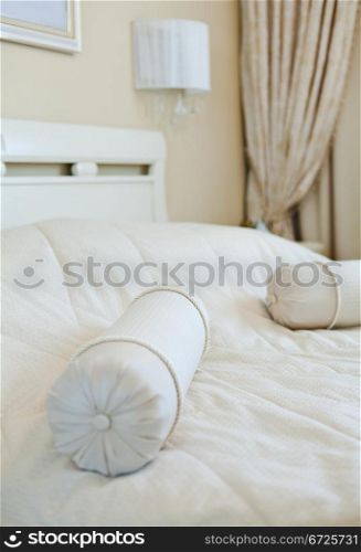 Elegant pillows on bed