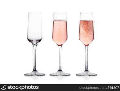 Elegant Rose pink champagne glasses with bubbles on white background with reflection