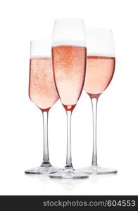 Elegant Rose pink champagne glasses with bubbles on white background with reflection