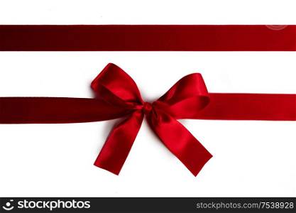 Elegant satin red ribbon bow isolated on white background. Red ribbon bow isolated on white