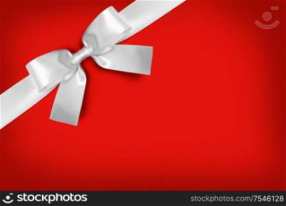 Elegant satin white ribbon bow on red background. White ribbon bow on red