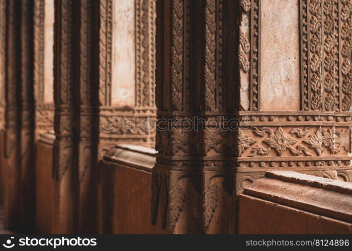 Elegant stucco decorations of the columns and terrace of the ancient Buddhist temple in Haw Phra Kaew, is a former temple in Vientiane, Laos.