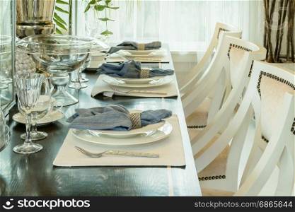 elegant table set in classic style dining room interior