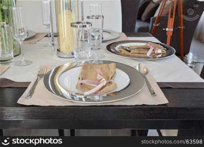 elegant table set in modern style dining room interior