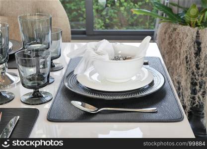 elegant table set on dining table in modern style dining room interior