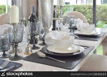 elegant table set on marble dining table in modern style dining room interior. elegant table set on marble dining table in modern style dining