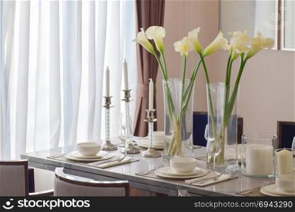 elegant table set on marble dining table in modern style dining room interior
