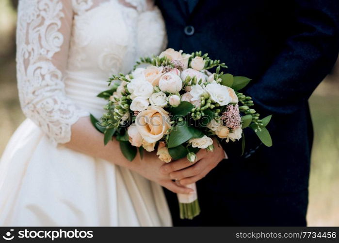 elegant wedding bouquet of fresh natural flowers and greenery