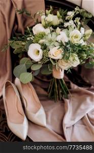 elegant wedding bouquet of fresh natural flowers and greenery