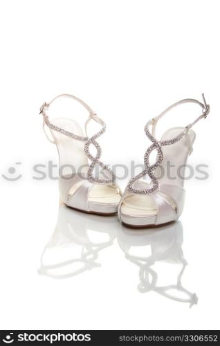 Elegant wedding shoes over white background
