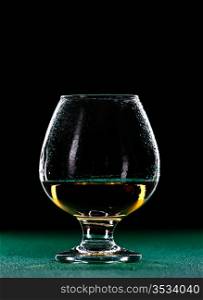 elegant whiskey glass isolated on black background