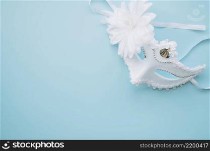 elegant white mask blue background