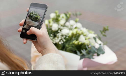 elegant woman city taking picture bouquet flowers