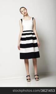 Elegant Woman Fashion Model in Light Striped Cotton Sundress. Vogue Style