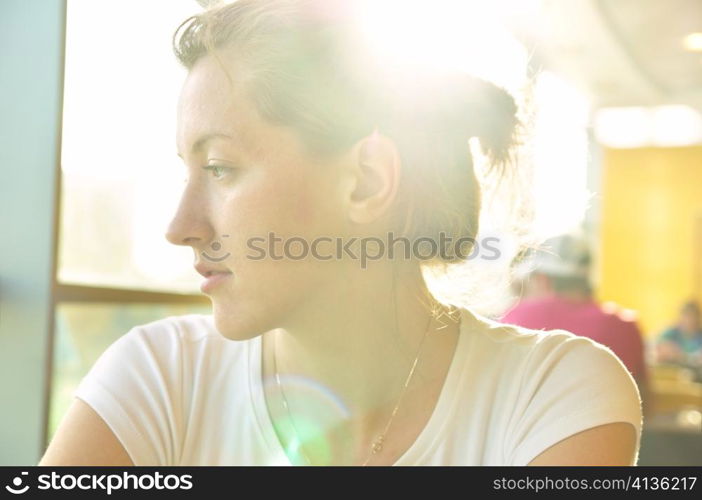 elegant woman in cafe is looking sideways