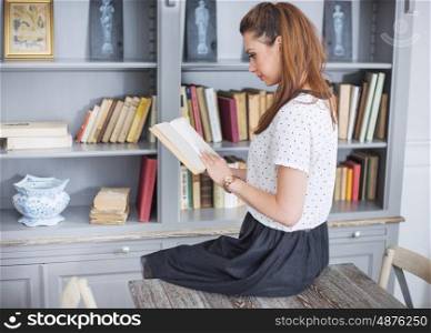 Elegant woman reading an interesting book