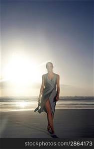 Elegant Woman Walking on the Beach