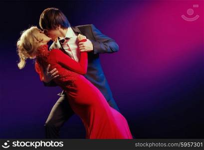Elegant young couple in the dance of love