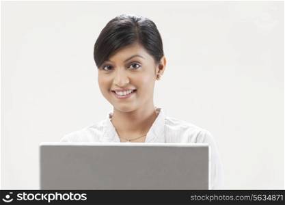 Elegant young woman using laptop