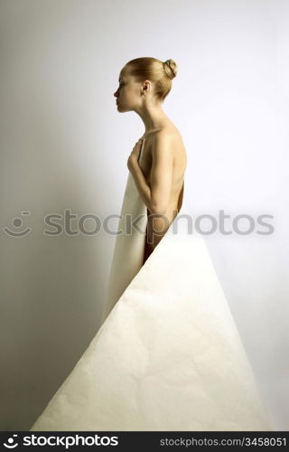 elegante girl with sheet of paper. studio photo.