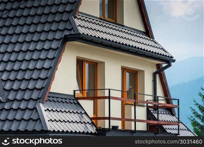 element of a villa architecture balcony and a roof close up