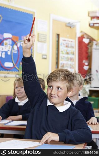 Elementary School Pupil Answering Question In Class