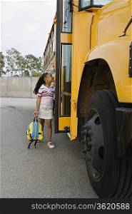 Elementary Student Getting onto School Bus