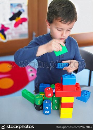 Elementary Student Playing With Building Blocks